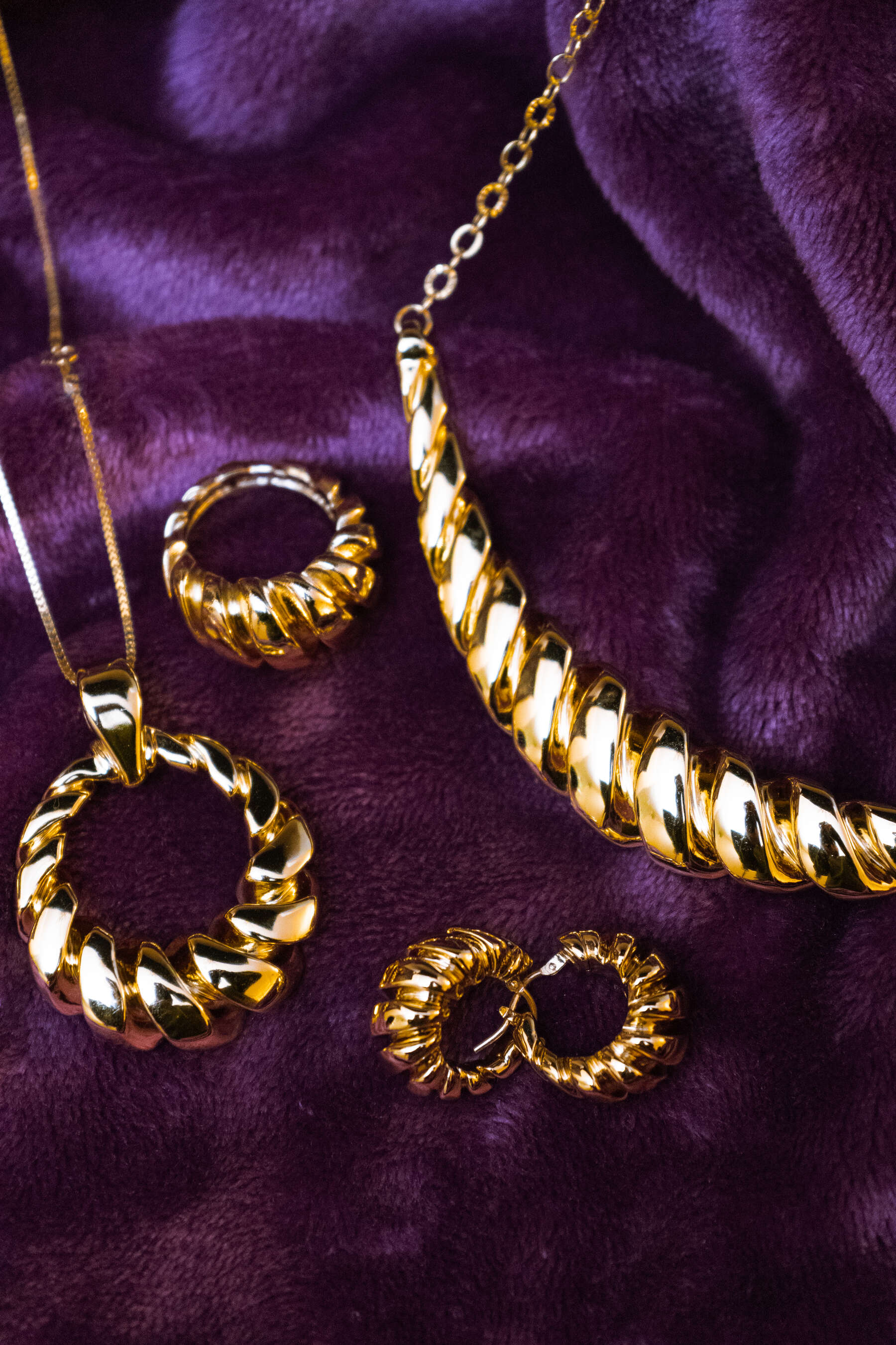 Gold set on purple velvet