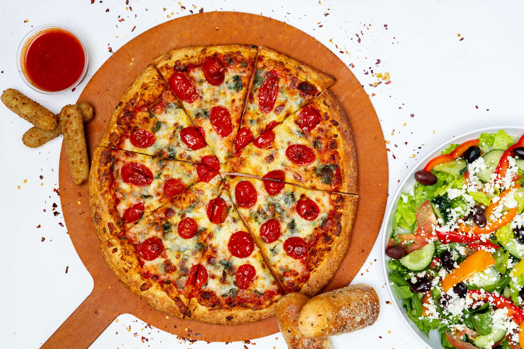 Full pizza overhead with salad